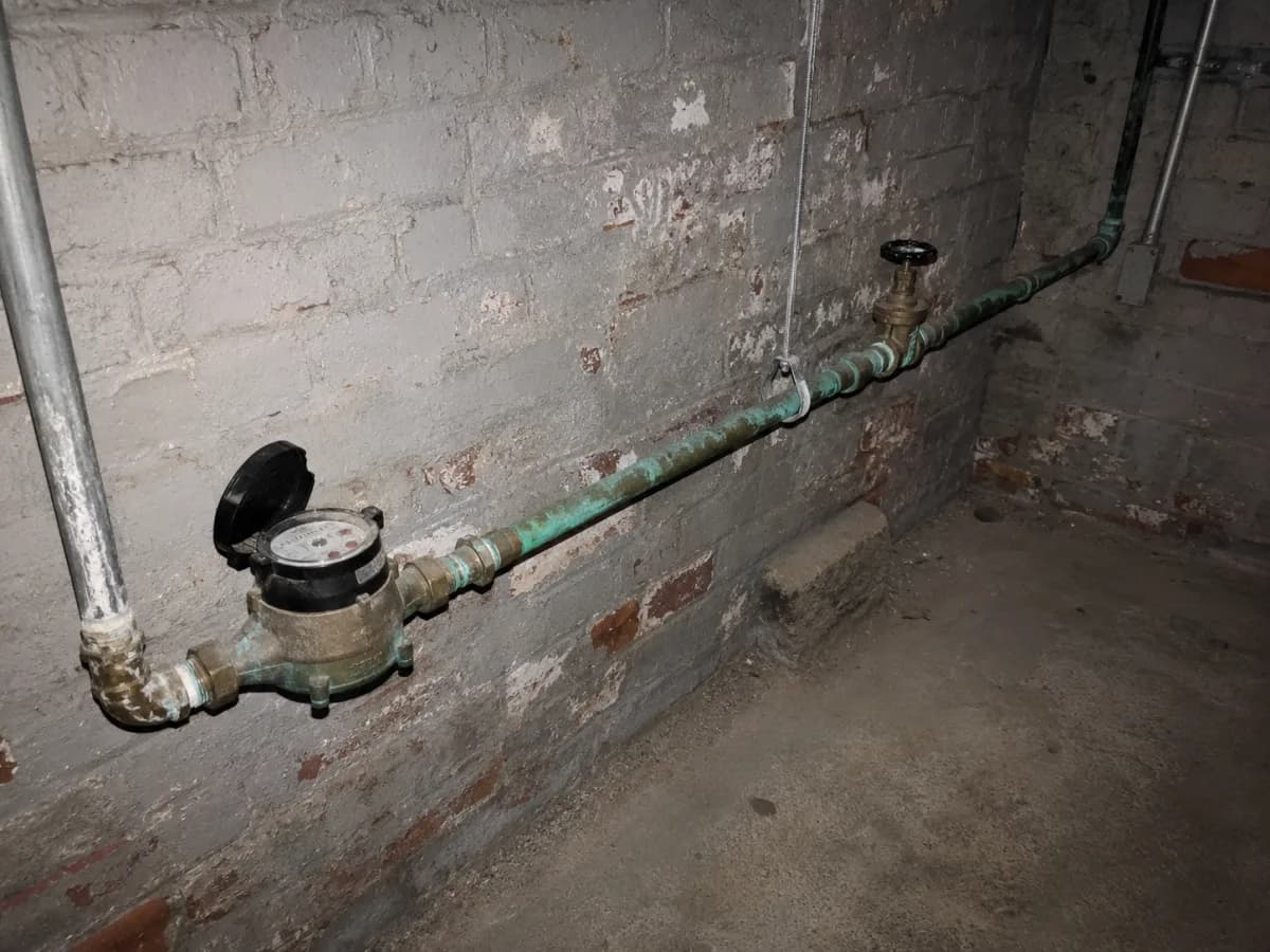 Pipe run into the property with clearance visible